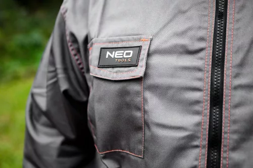 NEO TOOLS Munkavédelmi kabát, BASIC, XL/56, 35% pamut, 65% polyester, Többfunkciós zsebek, gumírozott derék, CE EN341 81-410-XL