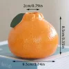 Stílusos narancssárga citrusforma váza