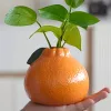 Stílusos narancssárga citrusforma váza