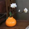 Stílusos narancssárga citrusforma váza